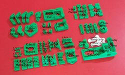 Photo of the printed parts used in the Huxley